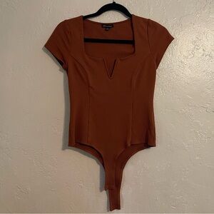 Beautiful rust Shinestar bodysuit